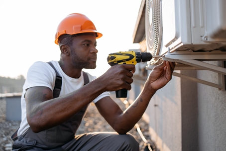 tech fixing hvac