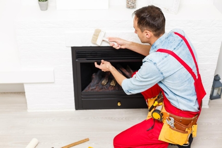 tech fixing a fireplace